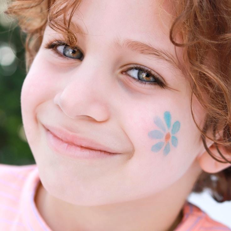 Kaveri Mehta, Lead Design Curator at SummitPanelStudio, reviewing corporate floral arrangements